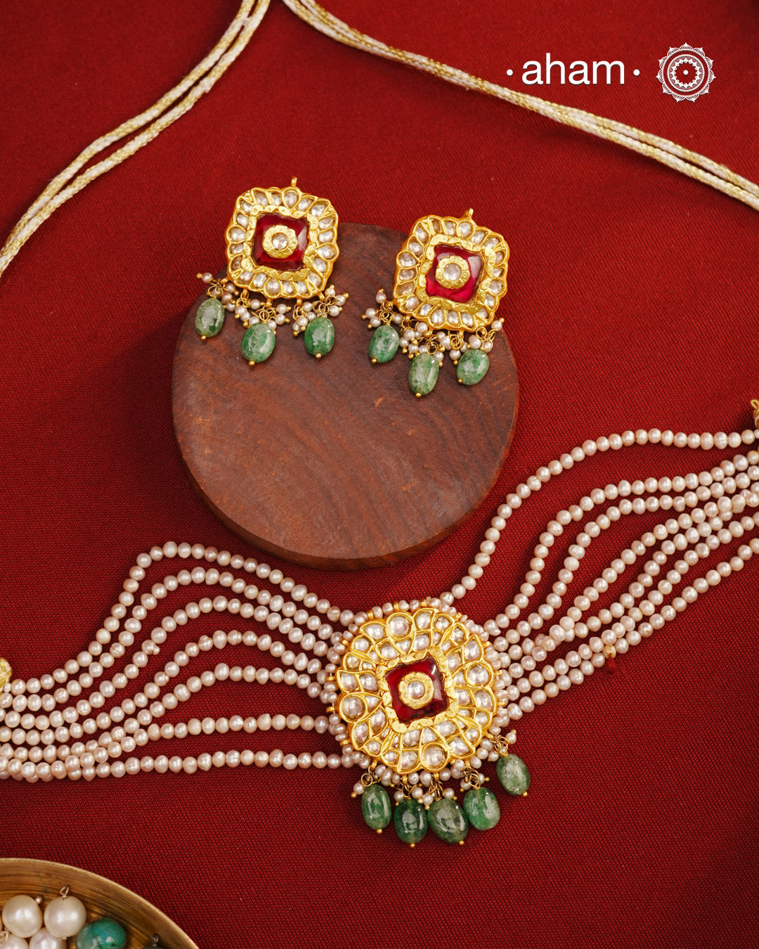 Adorn yourself with this breathtaking Kundan Gold Polish Silver Choker Set. Crafted from 92.5 sterling silver with stunning kundan detailing, the set features cultured pearls for a beautiful, royal feel. Style with any traditional outfit for an elegant look.