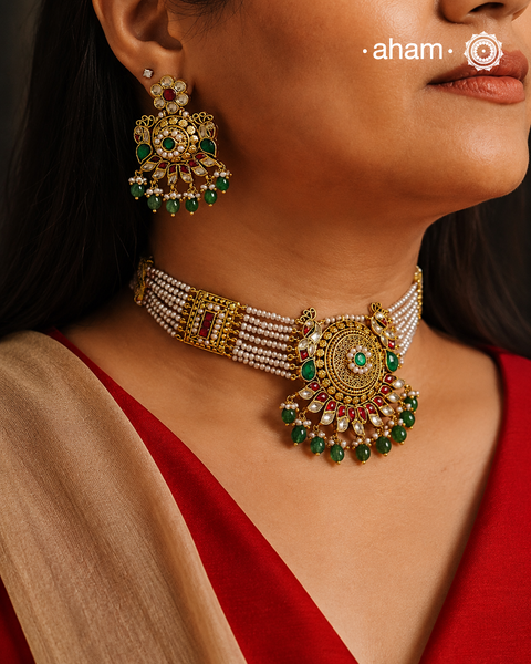 This Peacock Gold Polish Silver Choker Set is a beautiful traditional design crafted from 92.5 sterling silver and finished in gold polish. This stunning piece is further decorated with exquisite kundan and delicate pearl work.&nbsp; Perfect for weddings and festivities.