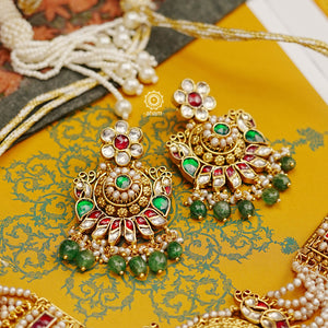 This Peacock Gold Polish Silver Choker Set is a beautiful traditional design crafted from 92.5 sterling silver and finished in gold polish. This stunning piece is further decorated with exquisite kundan and delicate pearl work.  Perfect for weddings and festivities.