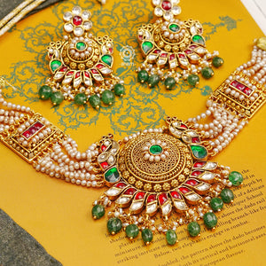 This Peacock Gold Polish Silver Choker Set is a beautiful traditional design crafted from 92.5 sterling silver and finished in gold polish. This stunning piece is further decorated with exquisite kundan and delicate pearl work.  Perfect for weddings and festivities.