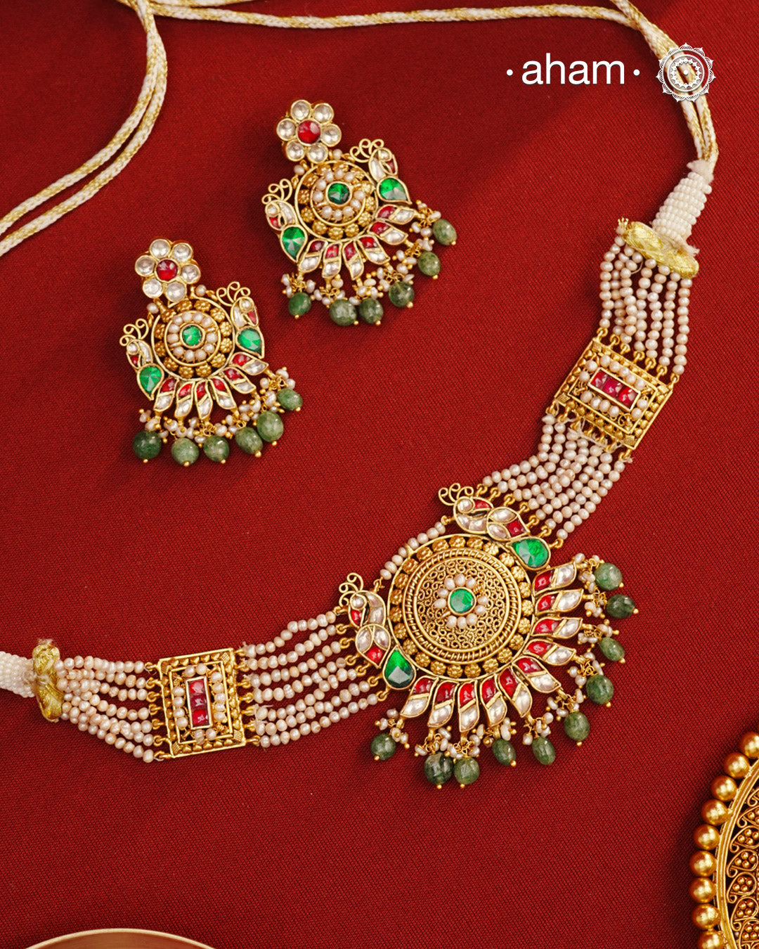 This Peacock Gold Polish Silver Choker Set is a beautiful traditional design crafted from 92.5 sterling silver and finished in gold polish. This stunning piece is further decorated with exquisite kundan and delicate pearl work. Perfect for weddings and festivities.