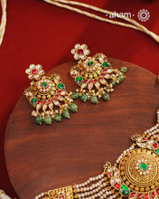 This Peacock Gold Polish Silver Choker Set is a beautiful traditional design crafted from 92.5 sterling silver and finished in gold polish. This stunning piece is further decorated with exquisite kundan and delicate pearl work. Perfect for weddings and festivities.