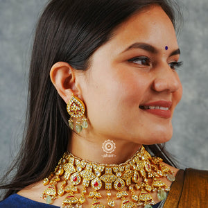 Jewellery is an art and it hold a great amount of cultural significance. This neckpiece earring set is a fine example of a traditional designs that never go out of style. Jadua Kundan set in sterling silver, dipped in gold and with beautiful semi precious stone highlights. Perfect for intimate weddings and upcoming festive celebrations.