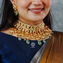 Jewellery is an art and it hold a great amount of cultural significance. This neckpiece earring set is a fine example of a traditional designs that never go out of style. Jadua Kundan set in sterling silver, dipped in gold and with beautiful semi precious stone highlights. Perfect for intimate weddings and upcoming festive celebrations.