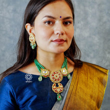 Make a sophisticated style statement this festive season with our beautiful gold polish neckpiece and earrings set. Crafted using traditional jadau kundan techniques in silver with semi precious beads and cultured pearls. Perfect for intimate weddings and upcoming festive celebrations.