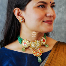 Make a sophisticated style statement this festive season with our beautiful gold polish  neckpiece and earrings set. Crafted using traditional jadau kundan techniques in silver with semi precious beads and cultured pearls. Perfect for intimate weddings and upcoming festive celebrations.