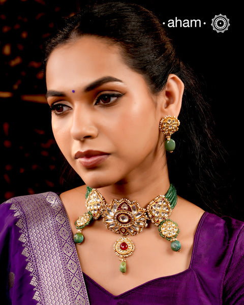 Make a sophisticated style statement this festive season with our beautiful gold polish parrot neckpiece and earrings set. Crafted using traditional jadau kundan techniques in silver with semi precious beads and cultured pearls. Perfect for intimate weddings and upcoming festive celebrations.