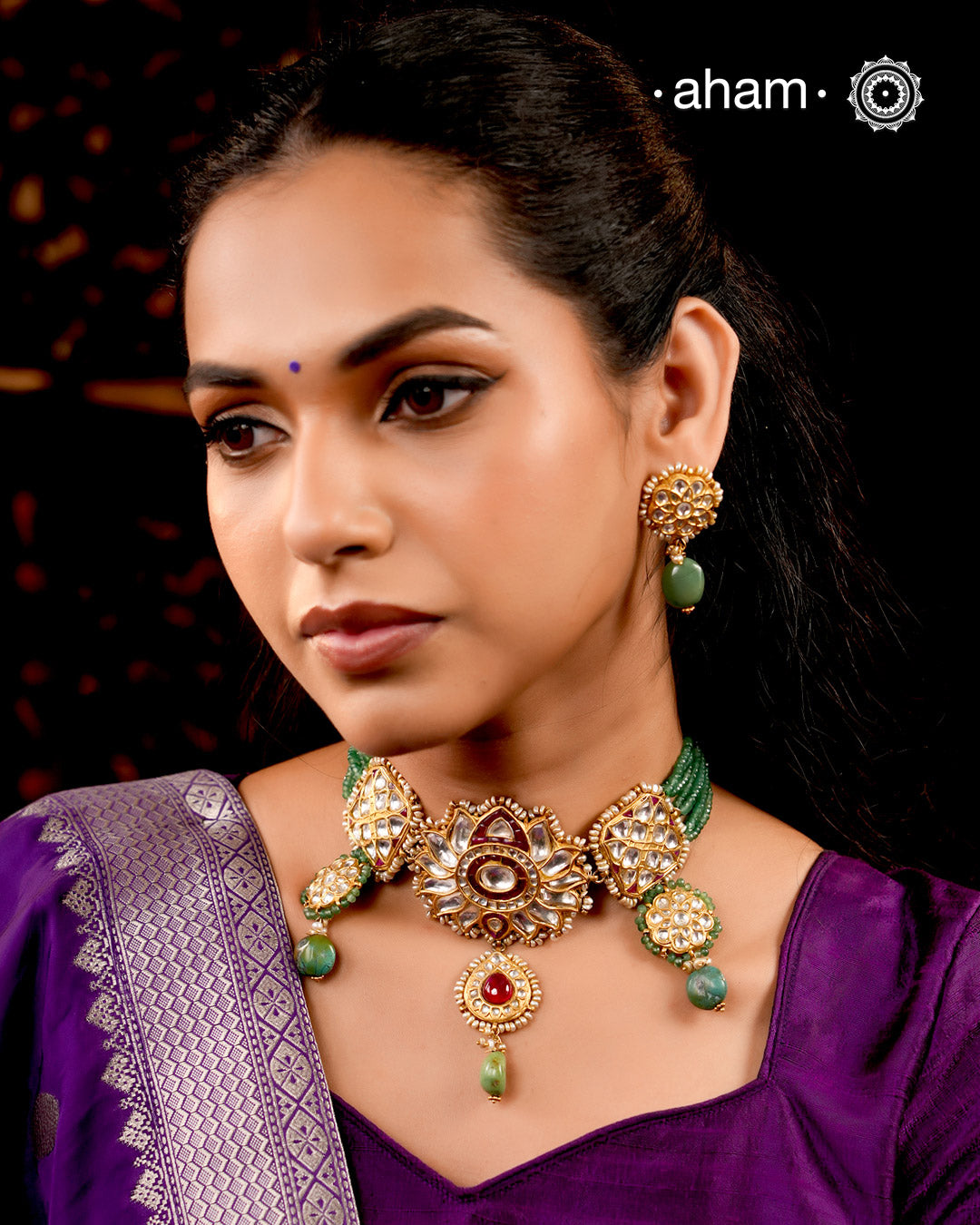 Make a sophisticated style statement this festive season with our beautiful gold polish parrot neckpiece and earrings set. Crafted using traditional jadau kundan techniques in silver with semi precious beads and cultured pearls. Perfect for intimate weddings and upcoming festive celebrations.