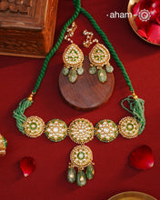 Make a sophisticated style statement this festive season with our beautiful gold polish neckpiece and earrings set. Crafted using traditional jadau kundan techniques in silver with semi precious beads and cultured pearls. The piece boast of the finest craftsmanship. Perfect for intimate weddings and upcoming festive celebrations.