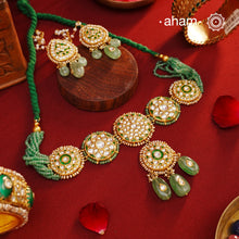 Make a sophisticated style statement this festive season with our beautiful gold polish neckpiece and earrings set. Crafted using traditional jadau kundan techniques in silver with semi precious beads and cultured pearls. The piece boast of the finest craftsmanship. Perfect for intimate weddings and upcoming festive celebrations.
