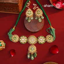 Make a sophisticated style statement this festive season with our beautiful gold polish neckpiece and earrings set. Crafted using traditional jadau kundan techniques in silver with semi precious beads and cultured pearls. The piece boast of the finest craftsmanship. Perfect for intimate weddings and upcoming festive celebrations.