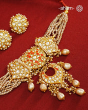 Make a style statement this festive season with our beautiful gold polish neckpiece and earrings set. Crafted using traditional jadau kundan techniques in silver with cultured pearls. Perfect for intimate weddings and upcoming festive celebrations.