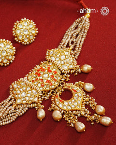 Make a style statement this festive season with our beautiful gold polish neckpiece and earrings set. Crafted using traditional jadau kundan techniques in silver with cultured pearls. Perfect for intimate weddings and upcoming festive celebrations.