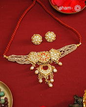 Make a style statement this festive season with our beautiful gold polish neckpiece and earrings set. Crafted using traditional jadau kundan techniques in silver with cultured pearls. Perfect for intimate weddings and upcoming festive celebrations.