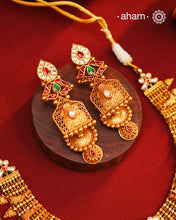 This Kundan Pearl Gold Polish Silver Neckpiece &amp; Earrings Set from our Heritage collection showcases intricate traditional designs, meticulously crafted in 92.5 silver with a stunning gold polish and exquisite kundan work. Perfect for modern brides seeking a touch of timeless elegance.