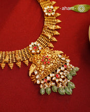 This Kundan Pearl Gold Polish Silver Neckpiece &amp; Earrings Set from our Heritage collection showcases intricate traditional designs, meticulously crafted in 92.5 silver with a stunning gold polish and exquisite kundan work. Perfect for modern brides seeking a touch of timeless elegance.