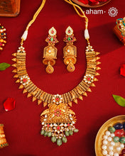 This Kundan Pearl Gold Polish Silver Neckpiece &amp; Earrings Set from our Heritage collection showcases intricate traditional designs, meticulously crafted in 92.5 silver with a stunning gold polish and exquisite kundan work. Perfect for modern brides seeking a touch of timeless elegance.