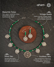A beautiful neckpiece that we have made using vintage pieces that are inspired from Himalayan jewellery from the regions of nepal and tibet. 
The shapes are inspired from the mandala Ga'u forms with Intricate patterns,  and they are interspersed with malachite beads and small silver beads that have intricate detailing on them. The center pendant depicts Goddess Tara. 
Extremely fine workmanship and one of a kind piece. 