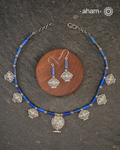 A beautiful neckpiece that we have made using vintage pieces that are inspired from Himalayan jewellery from the regions of nepal and tibet. 
The shapes are inspired from the Ga'u forms with Intricate floral patterns and they are interspersed with lapiz beads and small silver beads that have intricate detailing on them. 
