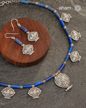 A beautiful neckpiece that we have made using vintage pieces that are inspired from Himalayan jewellery from the regions of nepal and tibet. 
The shapes are inspired from the Ga'u forms with Intricate floral patterns and they are interspersed with lapiz beads and small silver beads that have intricate detailing on them. 