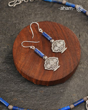 A beautiful neckpiece that we have made using vintage pieces that are inspired from Himalayan jewellery from the regions of nepal and tibet. 
The shapes are inspired from the Ga'u forms with Intricate floral patterns and they are interspersed with lapiz beads and small silver beads that have intricate detailing on them. 