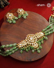 Experience the brilliance of the Moissanite Gold Polish Silver Neckpiece &amp; Earrings Set, expertly crafted in 92.5% silver with a refined gold polish. This set features moissanite stones that closely mimic the sparkle of real diamonds, elegantly strung on natural green aventurine stones for a sophisticated look. Perfect for adding timeless elegance to any ensemble, it combines classic design with exquisite craftsmanship.