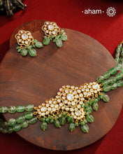 Experience the brilliance of the Moissanite Gold Polish Silver Neckpiece &amp; Earrings Set, expertly crafted in 92.5% silver with a refined gold polish. This set features moissanite stones that closely mimic the sparkle of real diamonds, elegantly strung on natural green aventurine stones for a sophisticated look. Perfect for adding timeless elegance to any ensemble, it combines classic design with exquisite craftsmanship.