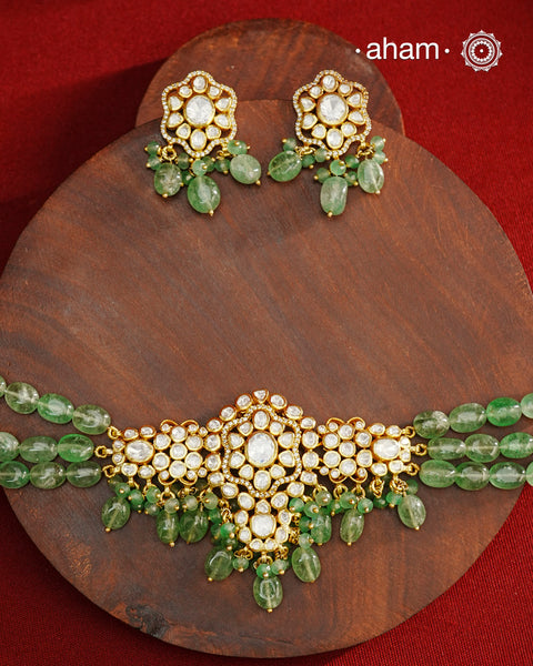 Experience the brilliance of the Moissanite Gold Polish Silver Neckpiece &amp; Earrings Set, expertly crafted in 92.5% silver with a refined gold polish. This set features moissanite stones that closely mimic the sparkle of real diamonds, elegantly strung on natural green aventurine stones for a sophisticated look. Perfect for adding timeless elegance to any ensemble, it combines classic design with exquisite craftsmanship.