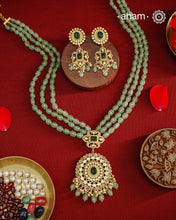 Experience the brilliance of the Moissanite Gold Polish Silver Neckpiece &amp; Earrings Set, expertly crafted in 92.5% silver with a refined gold polish. This set features moissanite stones that closely mimic the sparkle of real diamonds, elegantly strung on green beads for a sophisticated look. Perfect for adding timeless elegance to any ensemble, it combines classic design with exquisite craftsmanship.