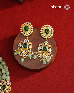 Experience the brilliance of the Moissanite Gold Polish Silver Neckpiece &amp; Earrings Set, expertly crafted in 92.5% silver with a refined gold polish. This set features moissanite stones that closely mimic the sparkle of real diamonds, elegantly strung on green beads for a sophisticated look. Perfect for adding timeless elegance to any ensemble, it combines classic design with exquisite craftsmanship.