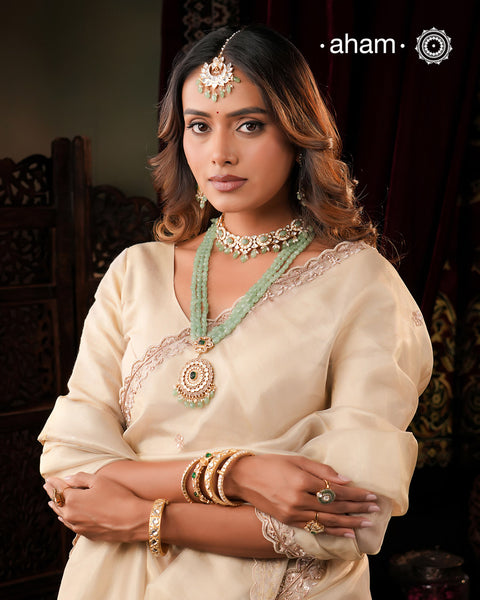Experience the brilliance of the Moissanite Gold Polish Silver Neckpiece & Earrings Set, expertly crafted in 92.5% silver with a refined gold polish. This set features moissanite stones that closely mimic the sparkle of real diamonds, elegantly strung on green beads for a sophisticated look. Perfect for adding timeless elegance to any ensemble, it combines classic design with exquisite craftsmanship.