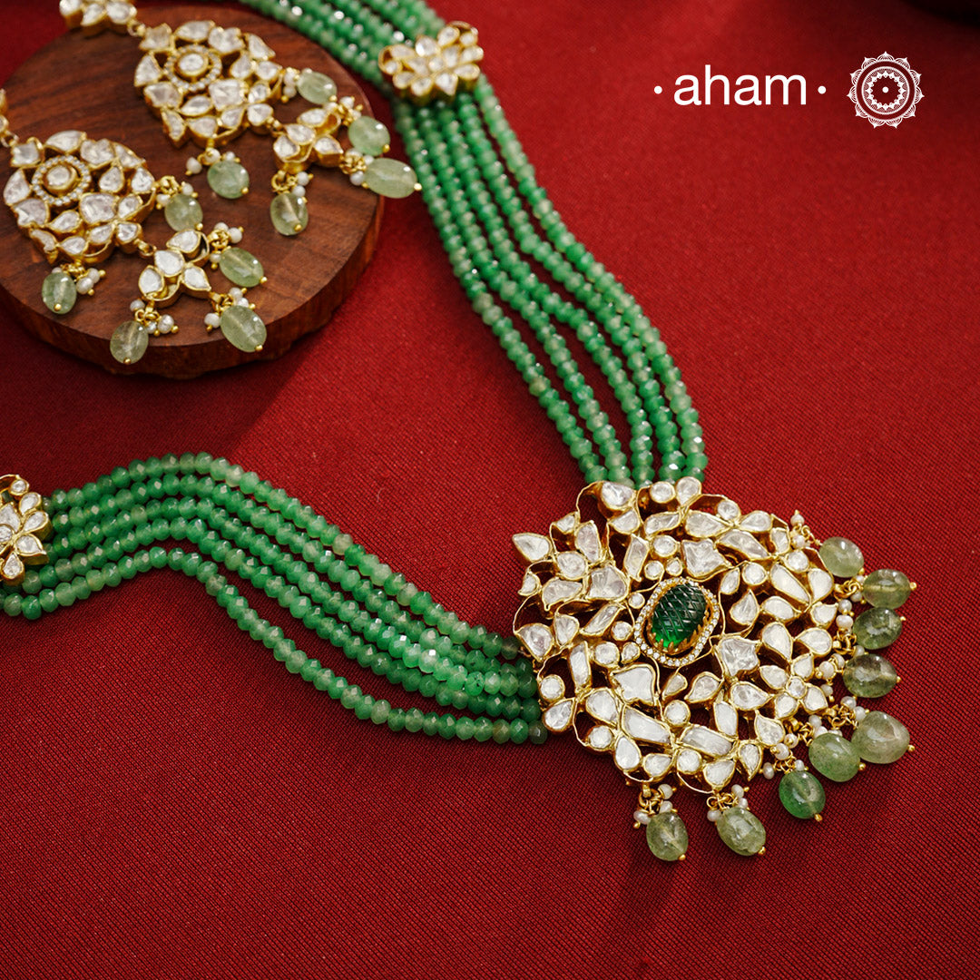 Experience the brilliance of the Moissanite Gold Polish Silver Neckpiece & Earrings Set, expertly crafted in 92.5% silver with a refined gold polish. This set features moissanite stones that closely mimic the sparkle of real diamonds, elegantly strung on green beads for a sophisticated look. Perfect for adding timeless elegance to any ensemble, it combines classic design with exquisite craftsmanship.