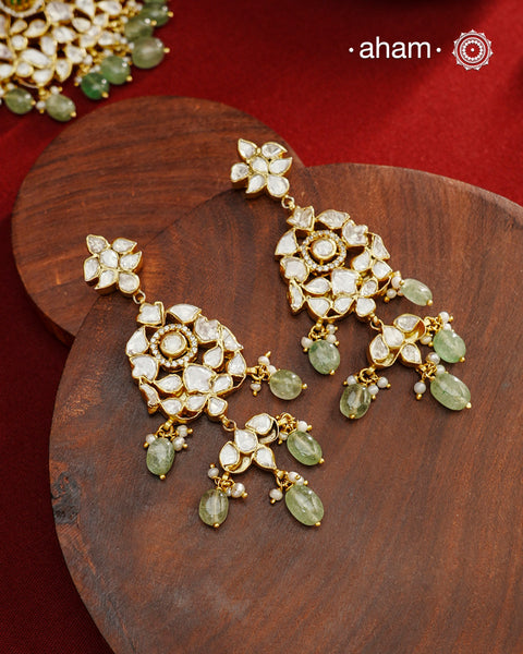 Experience the brilliance of the Moissanite Gold Polish Silver Neckpiece &amp; Earrings Set, expertly crafted in 92.5% silver with a refined gold polish. This set features moissanite stones that closely mimic the sparkle of real diamonds, elegantly strung on green beads for a sophisticated look. Perfect for adding timeless elegance to any ensemble, it combines classic design with exquisite craftsmanship.