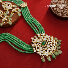 Experience the brilliance of the Moissanite Gold Polish Silver Neckpiece & Earrings Set, expertly crafted in 92.5% silver with a refined gold polish. This set features moissanite stones that closely mimic the sparkle of real diamonds, elegantly strung on green beads for a sophisticated look. Perfect for adding timeless elegance to any ensemble, it combines classic design with exquisite craftsmanship.