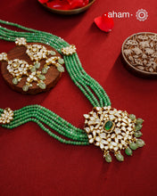Experience the brilliance of the Moissanite Gold Polish Silver Neckpiece &amp; Earrings Set, expertly crafted in 92.5% silver with a refined gold polish. This set features moissanite stones that closely mimic the sparkle of real diamonds, elegantly strung on green beads for a sophisticated look. Perfect for adding timeless elegance to any ensemble, it combines classic design with exquisite craftsmanship.