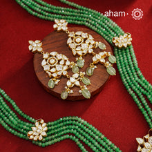 Experience the brilliance of the Moissanite Gold Polish Silver Neckpiece & Earrings Set, expertly crafted in 92.5% silver with a refined gold polish. This set features moissanite stones that closely mimic the sparkle of real diamonds, elegantly strung on green beads for a sophisticated look. Perfect for adding timeless elegance to any ensemble, it combines classic design with exquisite craftsmanship.