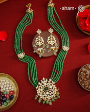 Experience the brilliance of the Moissanite Gold Polish Silver Neckpiece &amp; Earrings Set, expertly crafted in 92.5% silver with a refined gold polish. This set features moissanite stones that closely mimic the sparkle of real diamonds, elegantly strung on green beads for a sophisticated look. Perfect for adding timeless elegance to any ensemble, it combines classic design with exquisite craftsmanship.