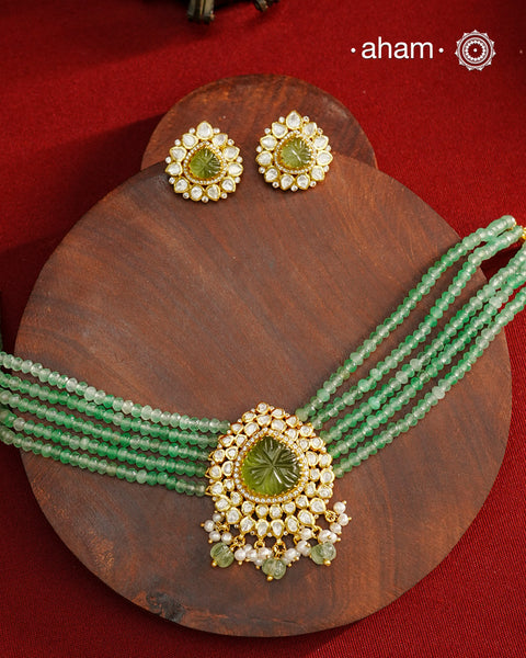 Experience the brilliance of the Moissanite Gold Polish Silver Neckpiece & Earrings Set, expertly crafted in 92.5% silver with a refined gold polish. This set features moissanite stones that closely mimic the sparkle of real diamonds, elegantly strung on green beads for a sophisticated look. Perfect for adding timeless elegance to any ensemble, it combines classic design with exquisite craftsmanship.