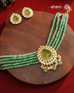 Experience the brilliance of the Moissanite Gold Polish Silver Neckpiece &amp; Earrings Set, expertly crafted in 92.5% silver with a refined gold polish. This set features moissanite stones that closely mimic the sparkle of real diamonds, elegantly strung on green beads for a sophisticated look. Perfect for adding timeless elegance to any ensemble, it combines classic design with exquisite craftsmanship.