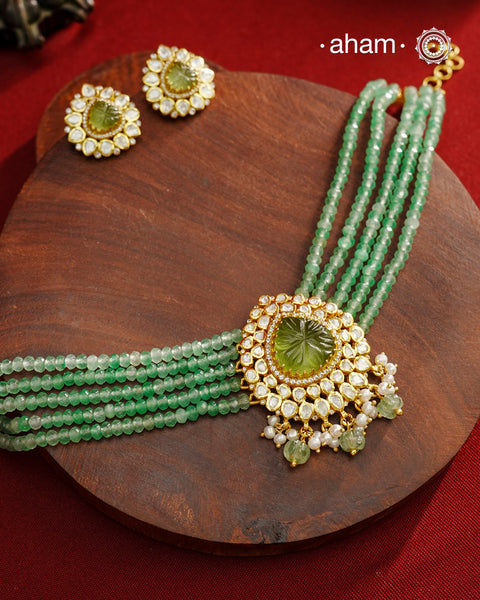Experience the brilliance of the Moissanite Gold Polish Silver Neckpiece &amp; Earrings Set, expertly crafted in 92.5% silver with a refined gold polish. This set features moissanite stones that closely mimic the sparkle of real diamonds, elegantly strung on green beads for a sophisticated look. Perfect for adding timeless elegance to any ensemble, it combines classic design with exquisite craftsmanship.