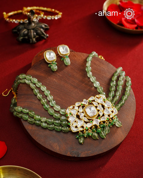 Experience the brilliance of the Moissanite Gold Polish Silver Neckpiece & Earrings Set, expertly crafted in 92.5% silver with a refined gold polish. This set features moissanite stones that closely mimic the sparkle of real diamonds, elegantly strung on natural green aventurine stones for a sophisticated look. Perfect for adding timeless elegance to any ensemble, it combines classic design with exquisite craftsmanship.