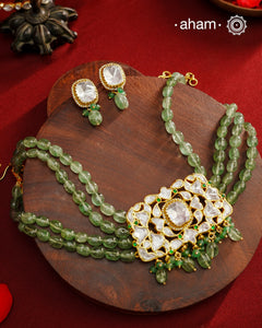 Experience the brilliance of the Moissanite Gold Polish Silver Neckpiece &amp; Earrings Set, expertly crafted in 92.5% silver with a refined gold polish. This set features moissanite stones that closely mimic the sparkle of real diamonds, elegantly strung on natural green aventurine stones for a sophisticated look. Perfect for adding timeless elegance to any ensemble, it combines classic design with exquisite craftsmanship.