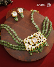 Experience the brilliance of the Moissanite Gold Polish Silver Neckpiece &amp; Earrings Set, expertly crafted in 92.5% silver with a refined gold polish. This set features moissanite stones that closely mimic the sparkle of real diamonds, elegantly strung on natural green aventurine stones for a sophisticated look. Perfect for adding timeless elegance to any ensemble, it combines classic design with exquisite craftsmanship.