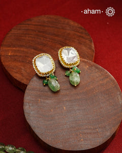 Experience the brilliance of the Moissanite Gold Polish Silver Neckpiece &amp; Earrings Set, expertly crafted in 92.5% silver with a refined gold polish. This set features moissanite stones that closely mimic the sparkle of real diamonds, elegantly strung on natural green aventurine stones for a sophisticated look. Perfect for adding timeless elegance to any ensemble, it combines classic design with exquisite craftsmanship.