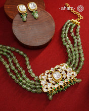 Experience the brilliance of the Moissanite Gold Polish Silver Neckpiece &amp; Earrings Set, expertly crafted in 92.5% silver with a refined gold polish. This set features moissanite stones that closely mimic the sparkle of real diamonds, elegantly strung on natural green aventurine stones for a sophisticated look. Perfect for adding timeless elegance to any ensemble, it combines classic design with exquisite craftsmanship.