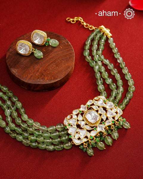 Experience the brilliance of the Moissanite Gold Polish Silver Neckpiece &amp; Earrings Set, expertly crafted in 92.5% silver with a refined gold polish. This set features moissanite stones that closely mimic the sparkle of real diamonds, elegantly strung on natural green aventurine stones for a sophisticated look. Perfect for adding timeless elegance to any ensemble, it combines classic design with exquisite craftsmanship.