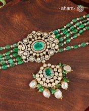 Experience the brilliance of the Moissanite Gold Polish Silver Neckpiece &amp; Earrings Set, expertly crafted in 92.5% silver with a refined gold polish. This set features moissanite stones that closely mimic the sparkle of real diamonds, elegantly strung on green beads for a sophisticated look. Perfect for adding timeless elegance to any ensemble, it combines classic design with exquisite craftsmanship.