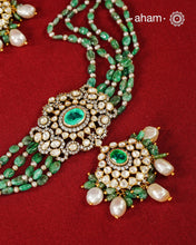 Experience the brilliance of the Moissanite Gold Polish Silver Neckpiece &amp; Earrings Set, expertly crafted in 92.5% silver with a refined gold polish. This set features moissanite stones that closely mimic the sparkle of real diamonds, elegantly strung on green beads for a sophisticated look. Perfect for adding timeless elegance to any ensemble, it combines classic design with exquisite craftsmanship.