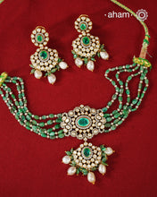 Experience the brilliance of the Moissanite Gold Polish Silver Neckpiece &amp; Earrings Set, expertly crafted in 92.5% silver with a refined gold polish. This set features moissanite stones that closely mimic the sparkle of real diamonds, elegantly strung on green beads for a sophisticated look. Perfect for adding timeless elegance to any ensemble, it combines classic design with exquisite craftsmanship.