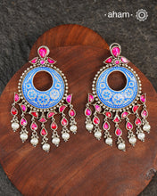 This Meena Work Festive Silver earrings is a stunning piece of jewellery perfect for special occasions.It features a combination of kundan and pearls with very contemporary enamelling work, all crafted in 92.5 silver.